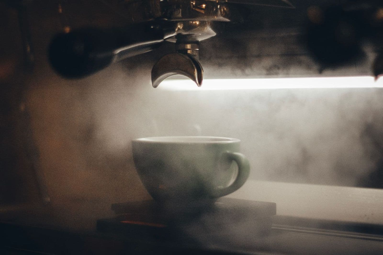 Automatic espresso machine making a cappuccino